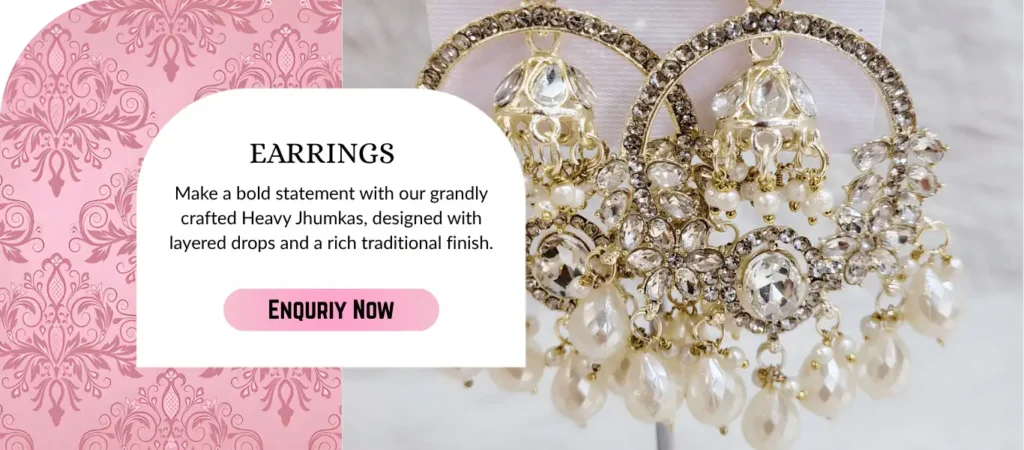 Heavy jhumka earrings with pearl drops and bridal ethnic jewellery design.